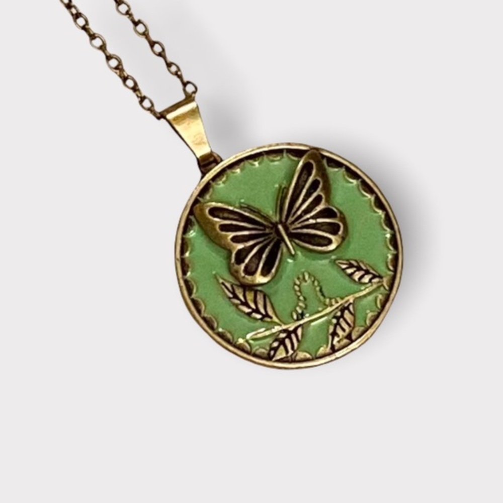 Butterfly necklace with ‘embrace change’ on the back